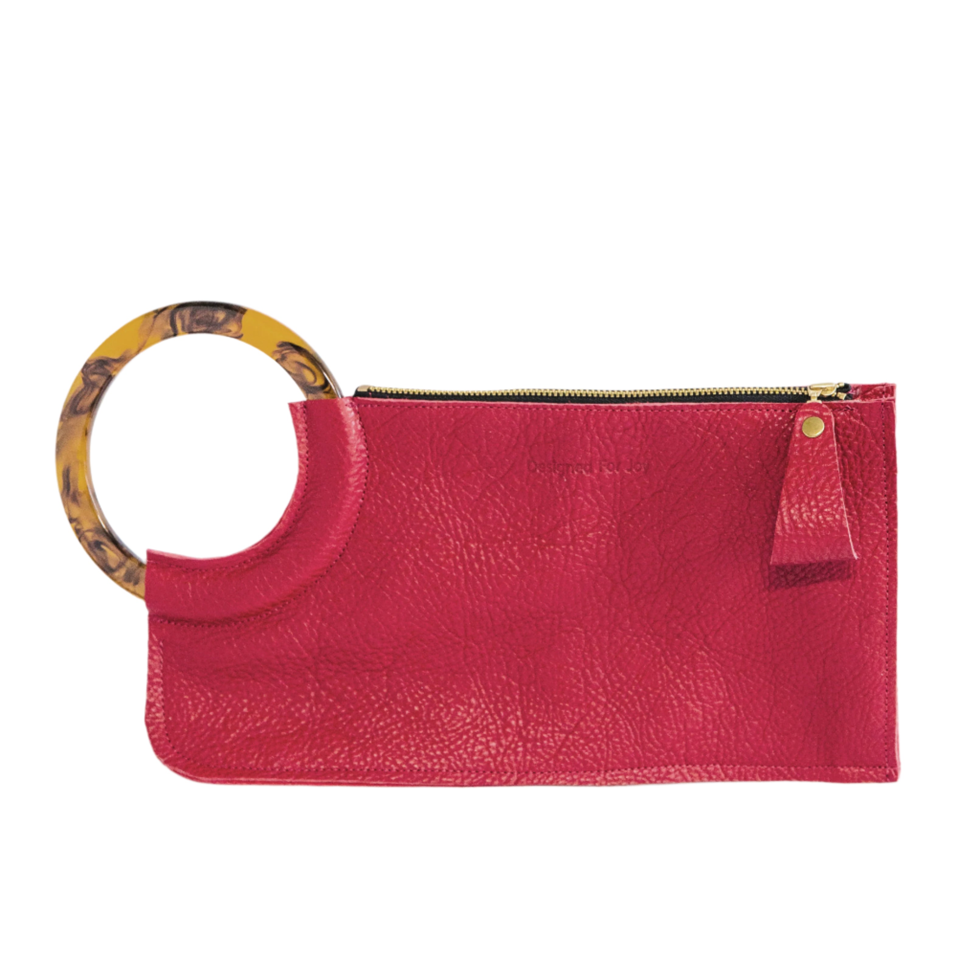 Red wristlet handbag with smooth resin handle and chunky zipper closure on a white background