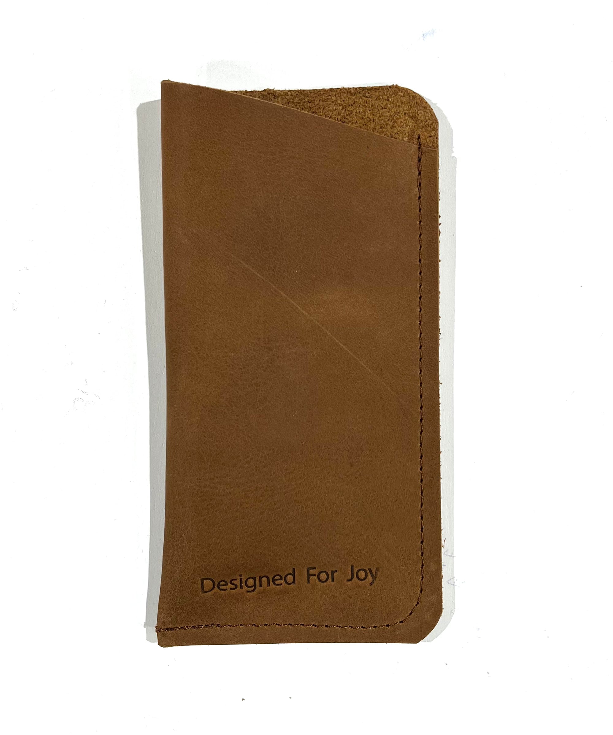 Brown slim eyeglass case with a suede interior and angled top design, displayed on a white background