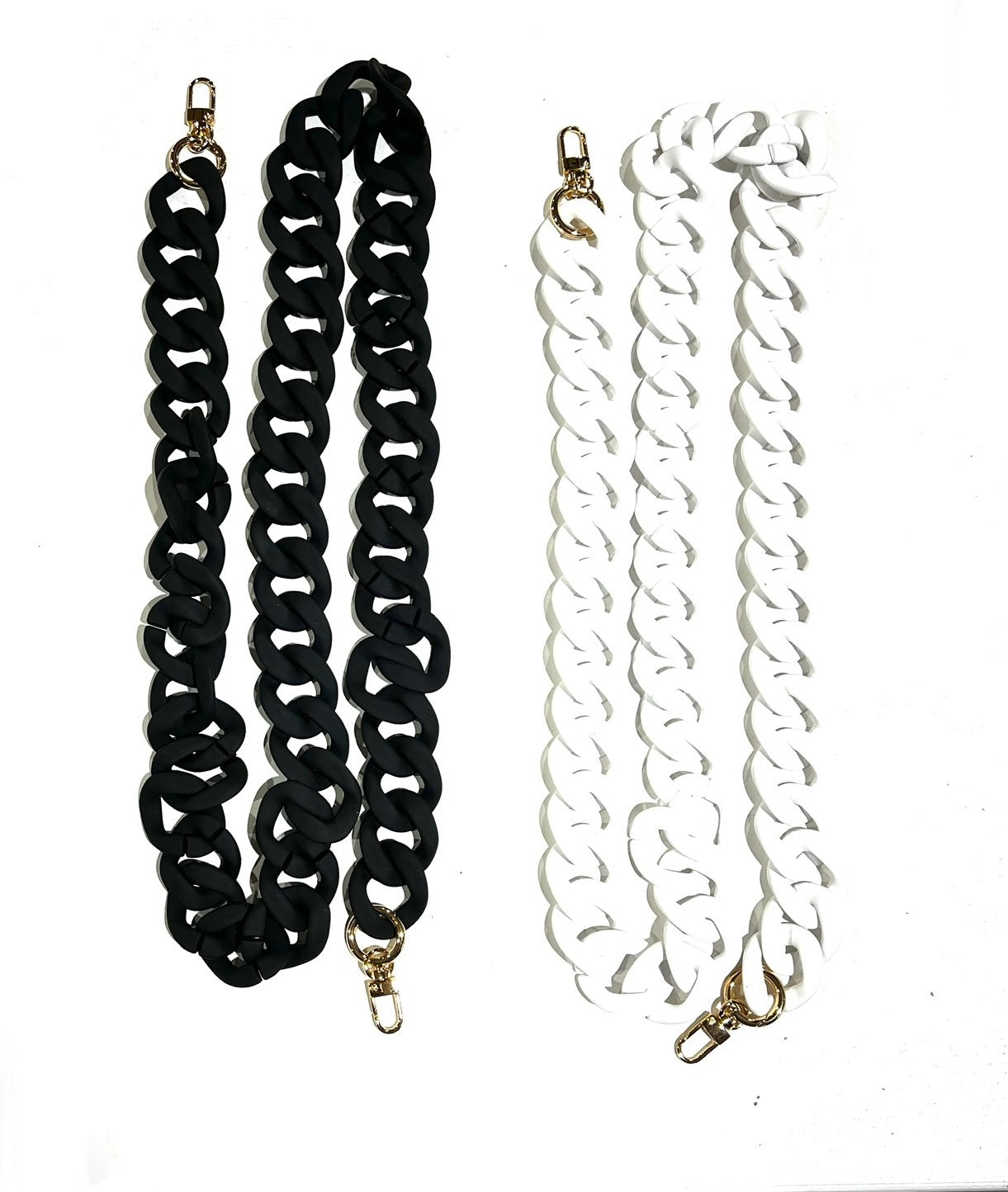 Two chunky acrylic crossbody chain straps in colors black and white, with gold clips on either end