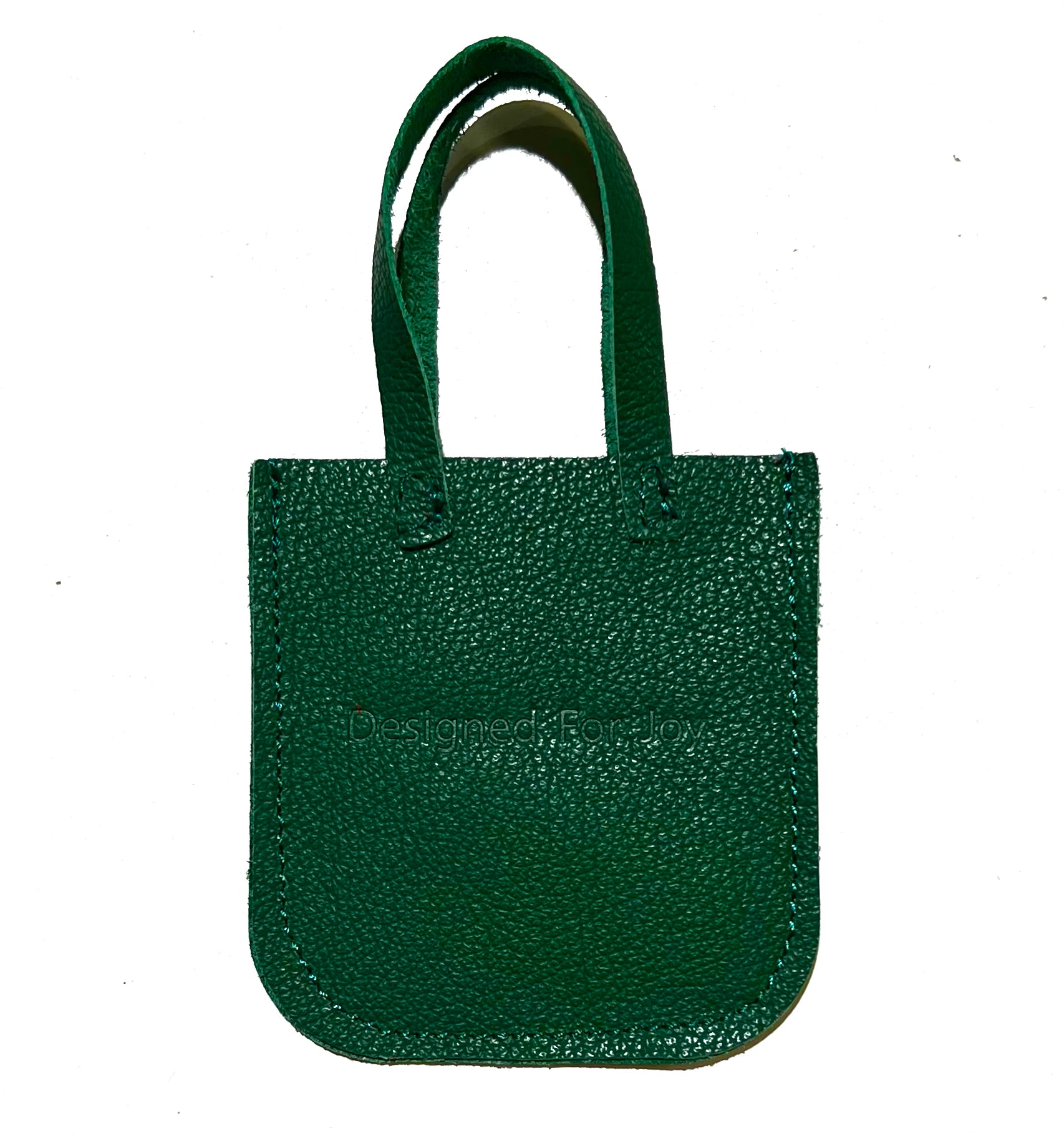 Green leather mini tote bag displayed on a white background