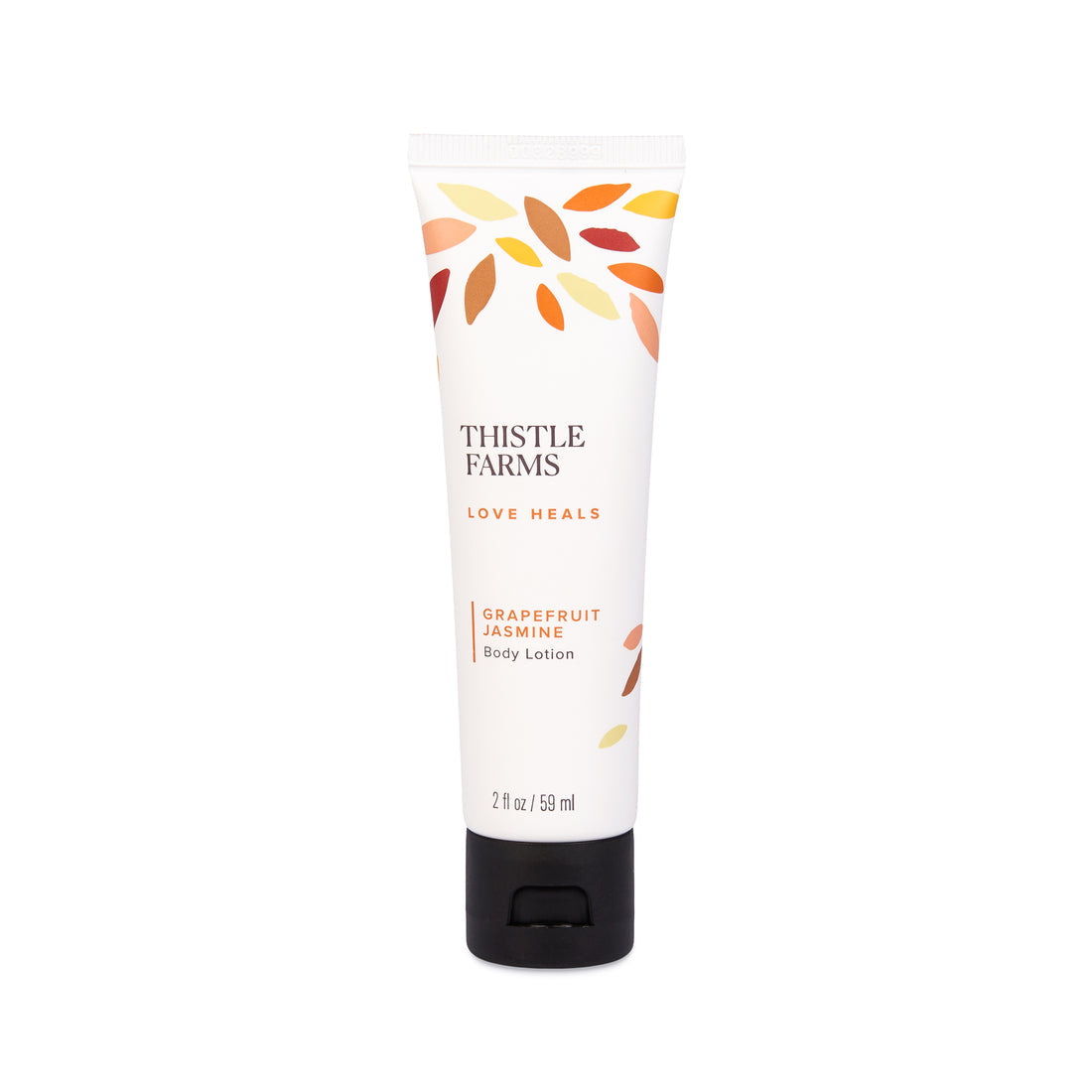 White tube of Thistle Farms Body Lotion labeled 'Grapefruit Jasmine' with leaf pattern, displayed on a white background