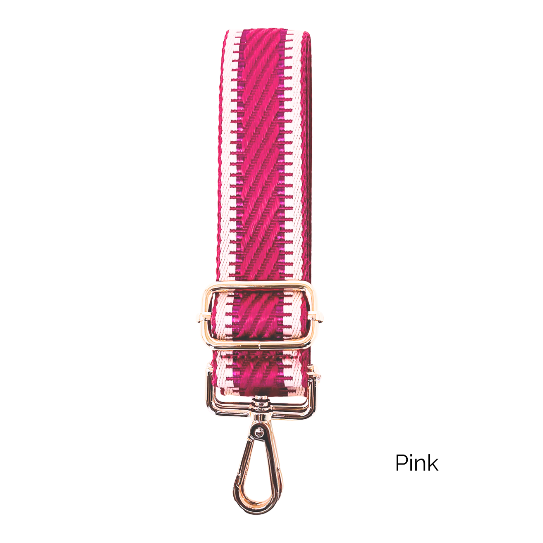 Pink crossbody strap with metallic thread details and gold hardware on a white background