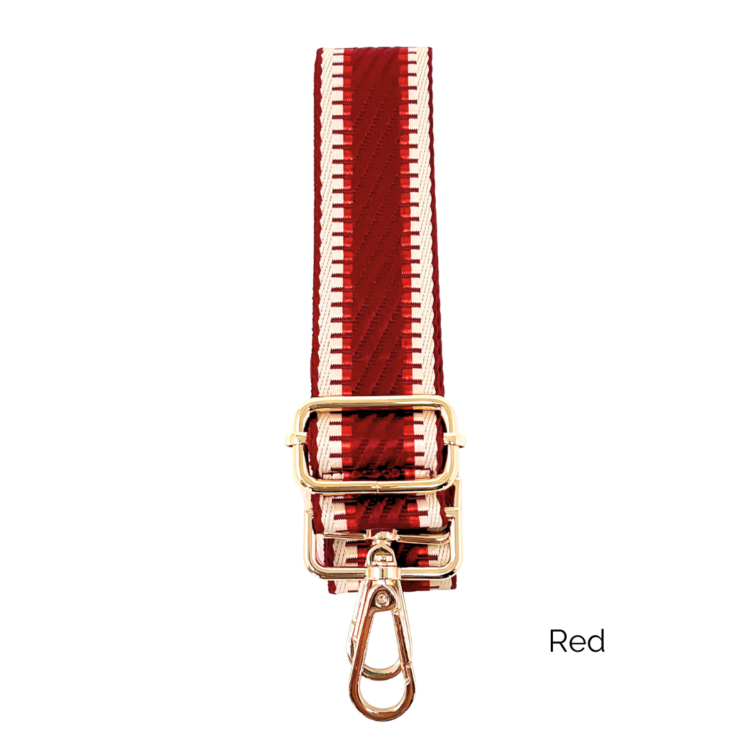 Red crossbody strap with metallic thread details and gold hardware on a white background
