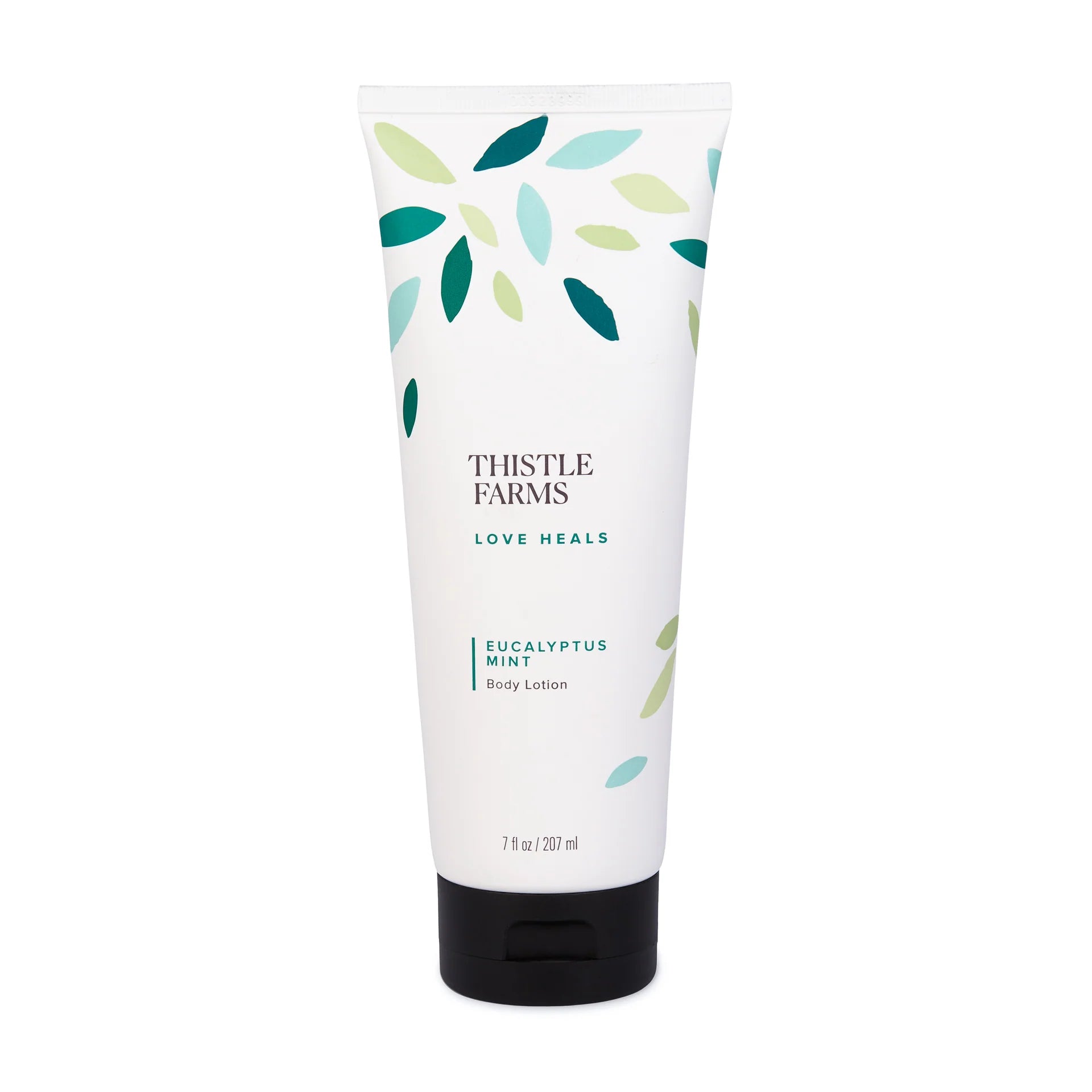 White tube of Thistle Farms Body Lotion labeled 'Eucalyptus Mint' with leaf pattern, displayed on a white background