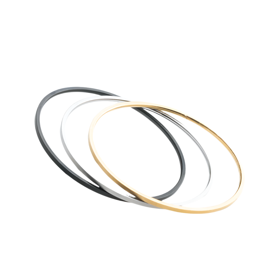 Three stainless steel bangles, displayed on a white background