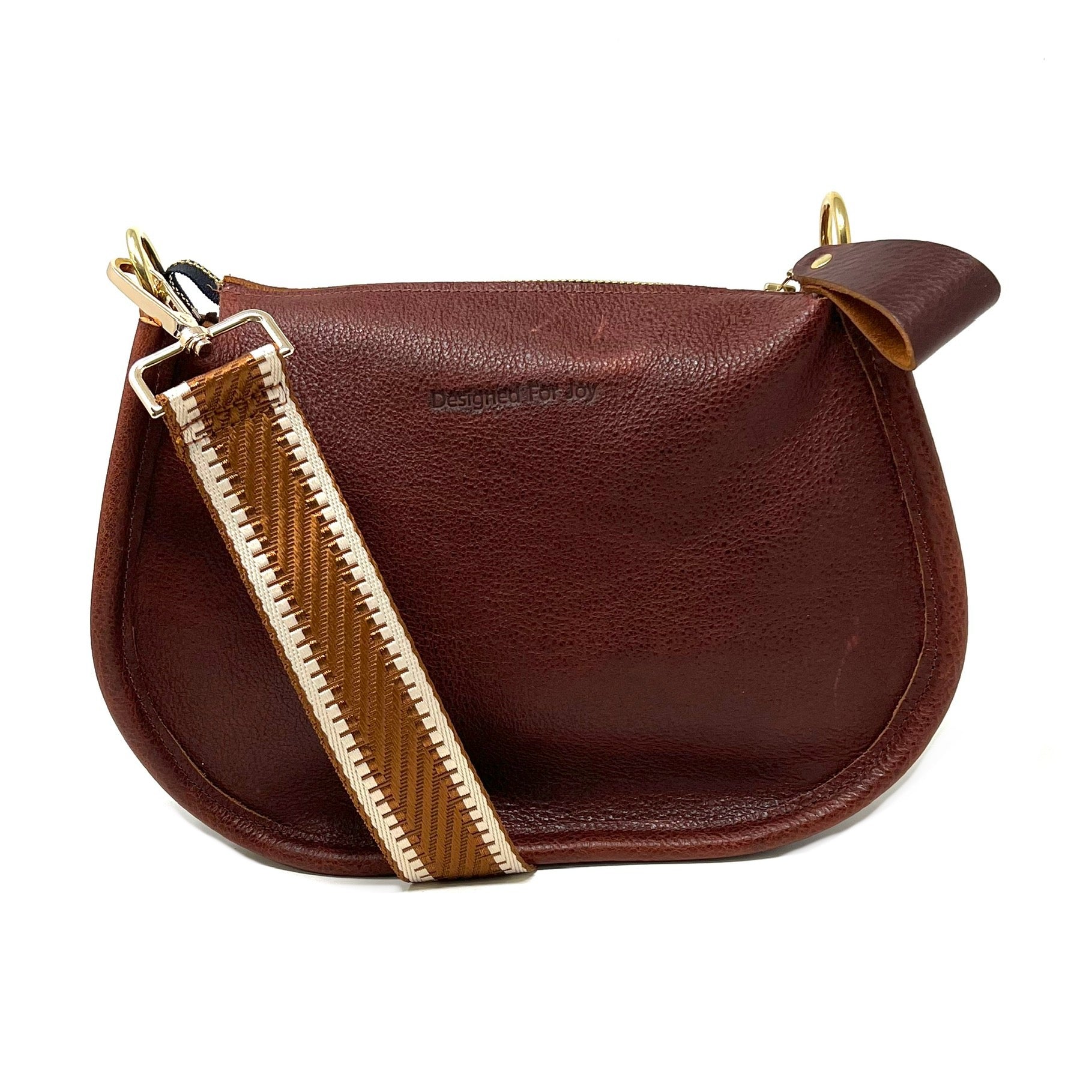 Cinnamon brown pebbled leather crossbody handbag with a smooth, chunky zipper and a crossbody strap