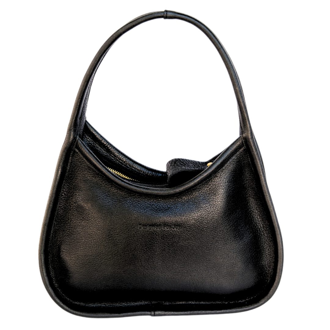 Black leather shoulder handbag with a wide base and narrow handles displayed on a white background