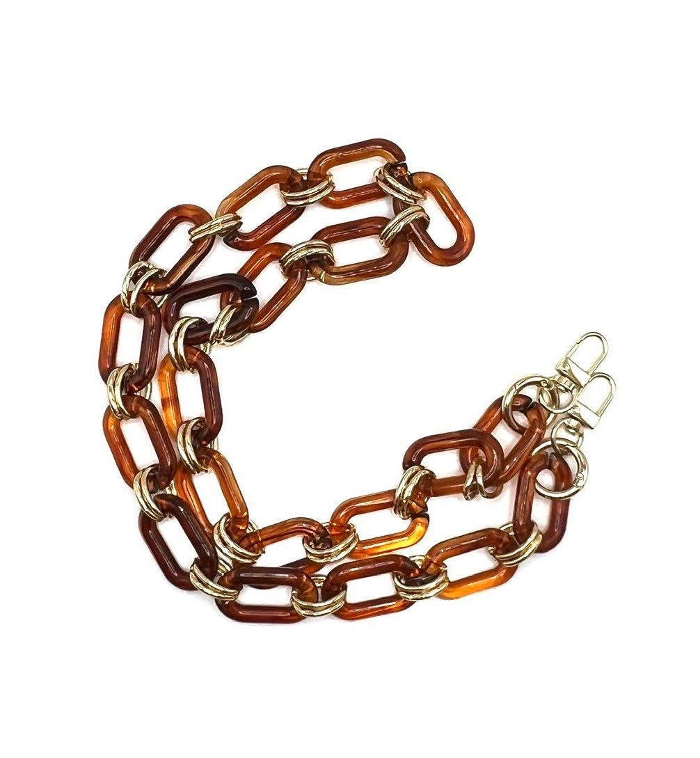 Amber acrylic chain crossbody handbag strap with gold accents and clips