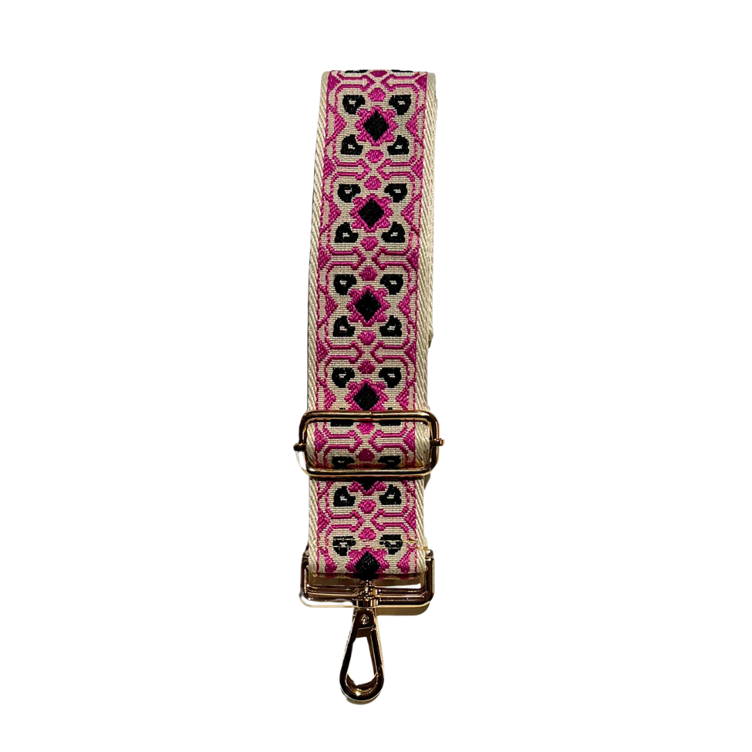 Pink and tan adjustable crossbody strap with a geometric pattern and metal hardware, displayed on a white background