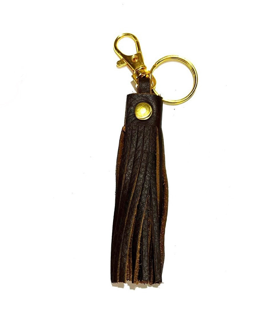 Brown leather tassel keychain, displayed on a white background