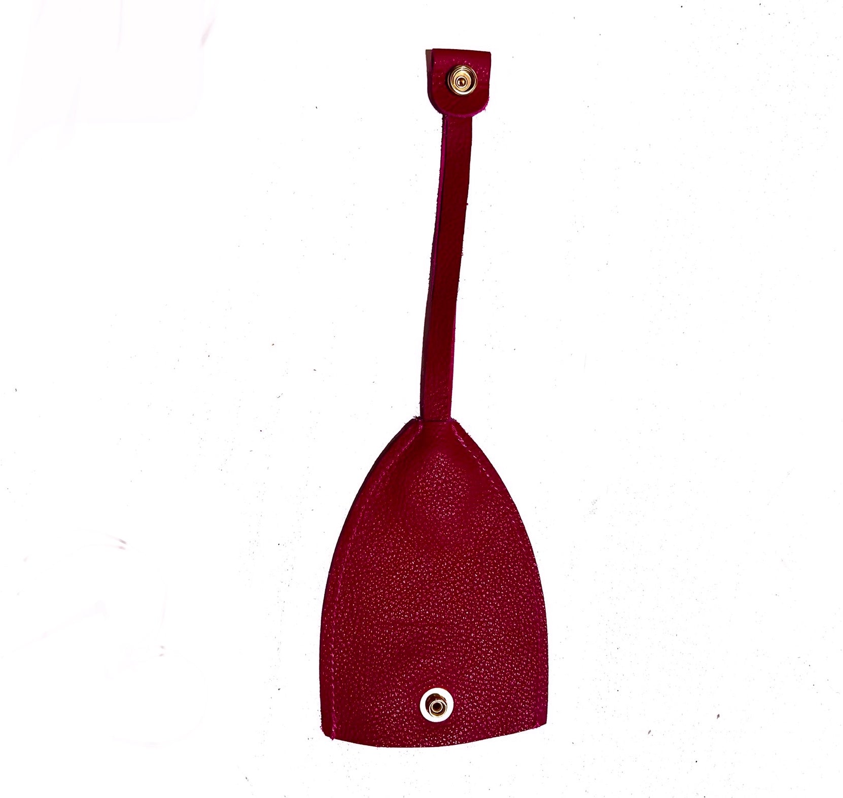 Pink car key cover with an open strap on a white background