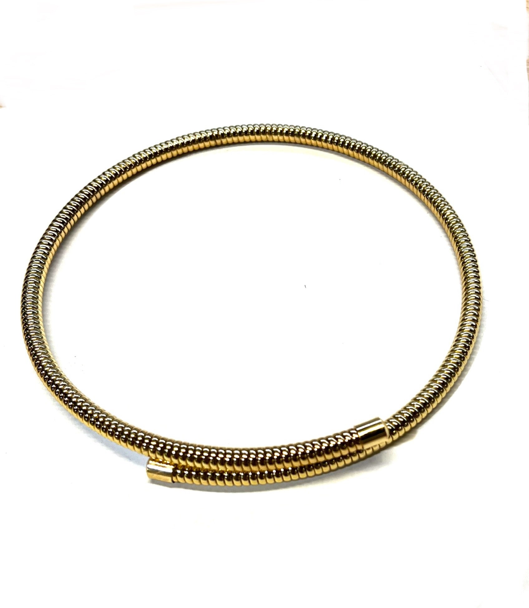 Gold-colored coil choker necklace with a mesh texture, displayed on a white background