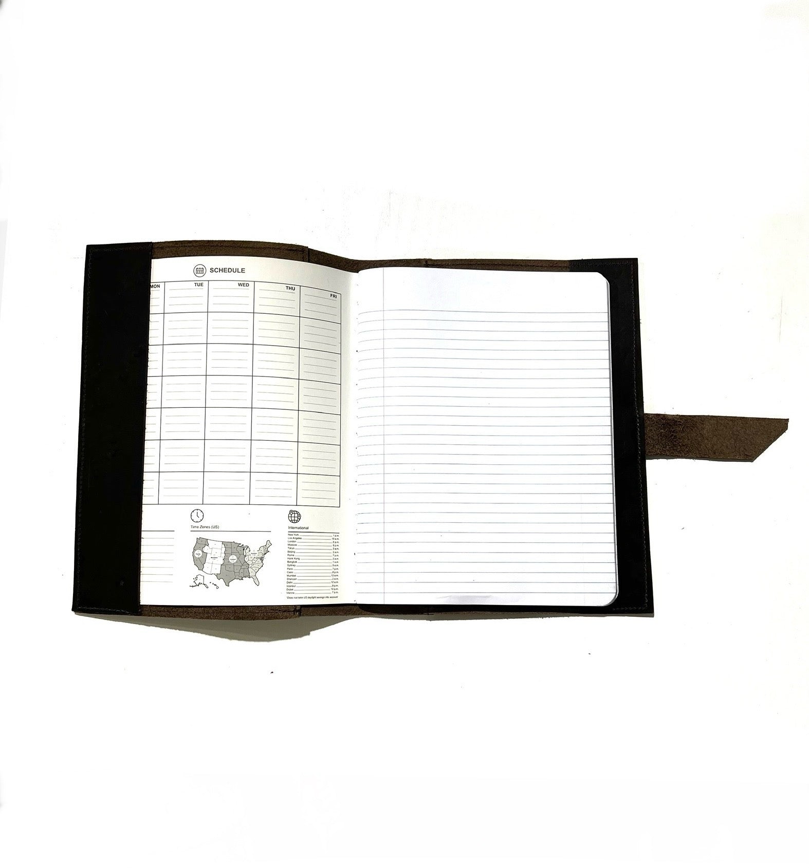 An open brown leather journal with lined pages, displayed on a white background