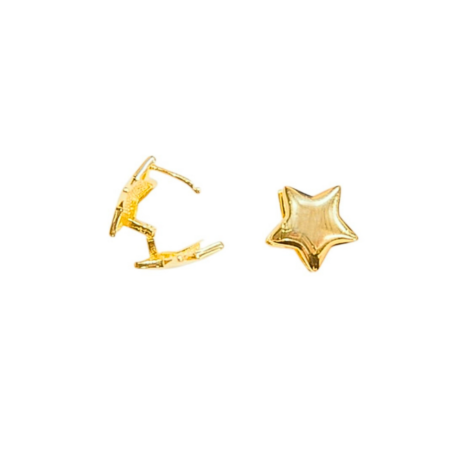 Pair of gold-colored double-sided star earrings on a white background