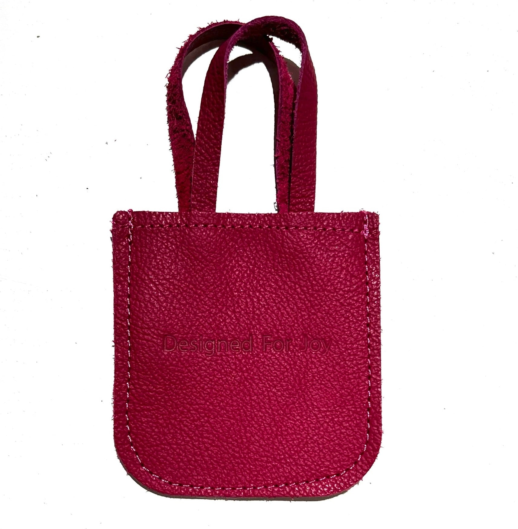Pink leather mini tote bag displayed on a white background