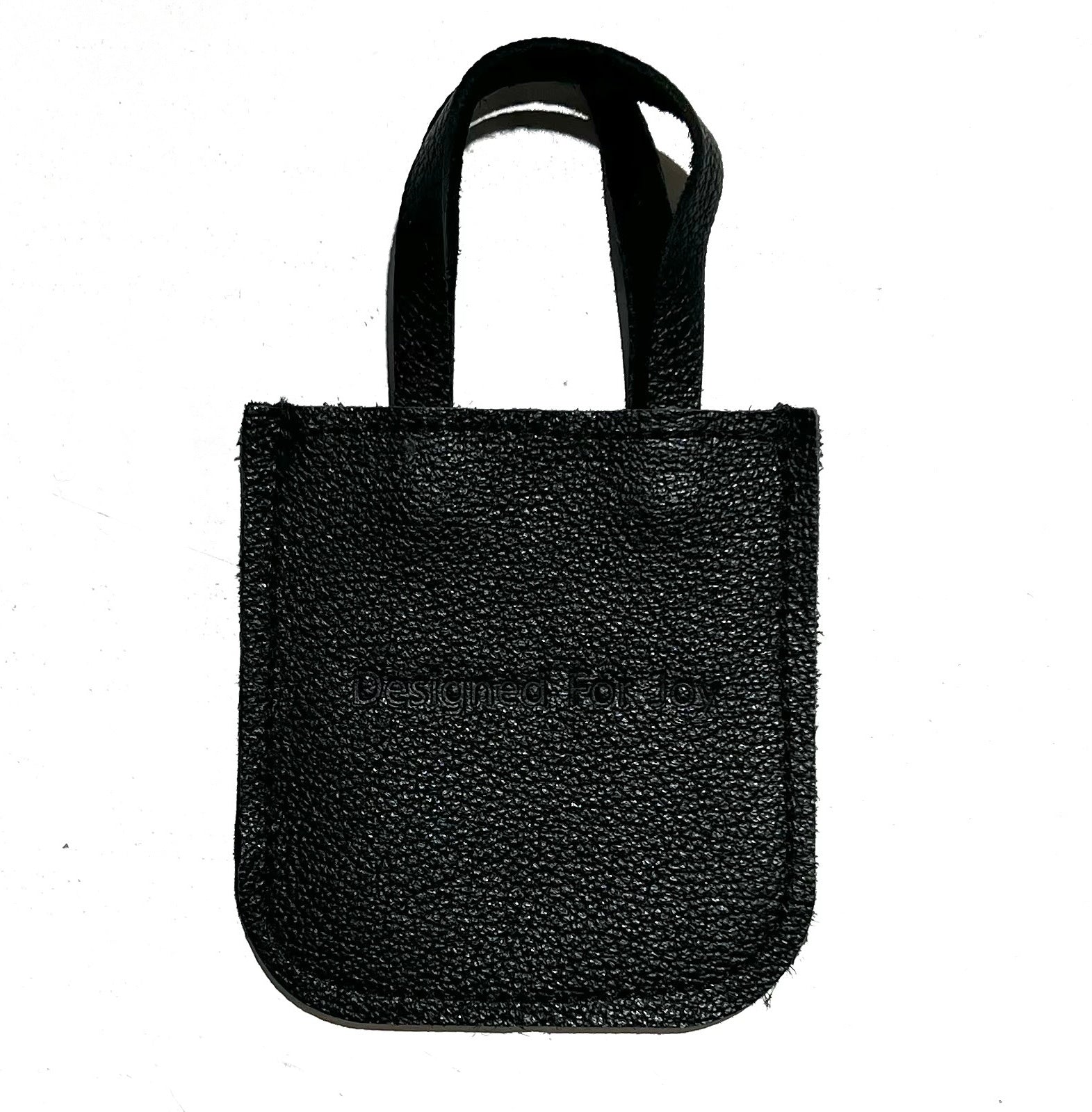 Black leather mini tote bag displayed on a white background