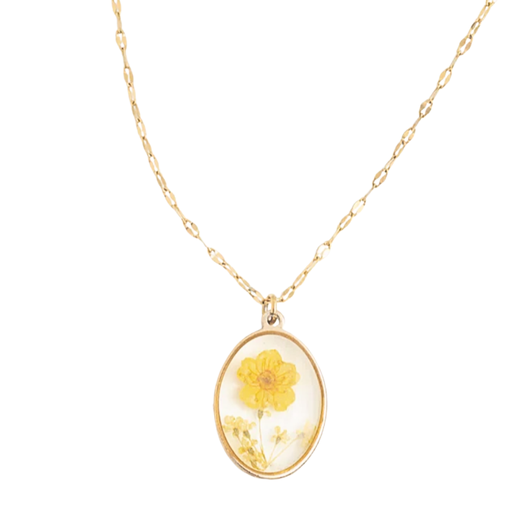 A gold-colored necklace with a floral yellow resin pendant , displayed on a white background
