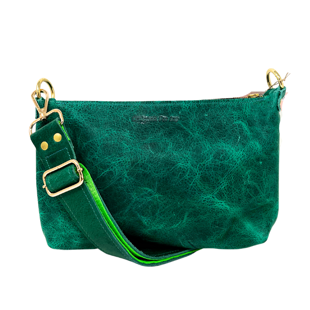 Green leather bag with a green strap on a white background