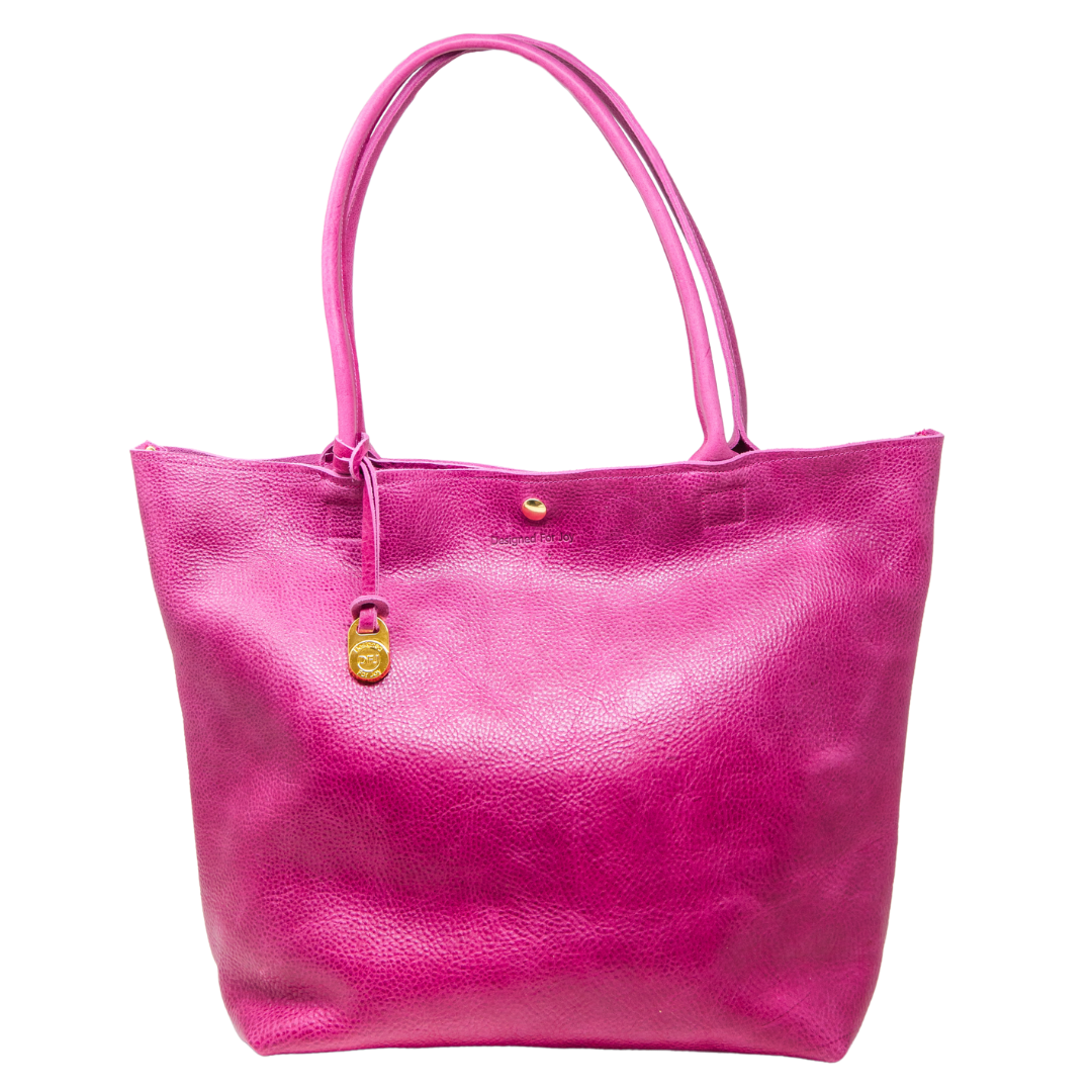 A large pink leather tote bag with a matching keychain and gold DFJ pendant, displayed on a white background