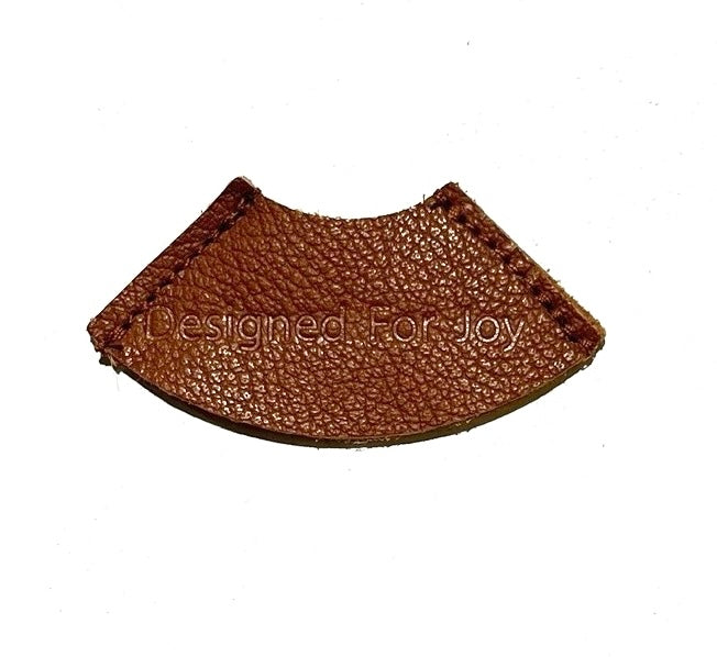 Caramel brown leather bookmark on a white background