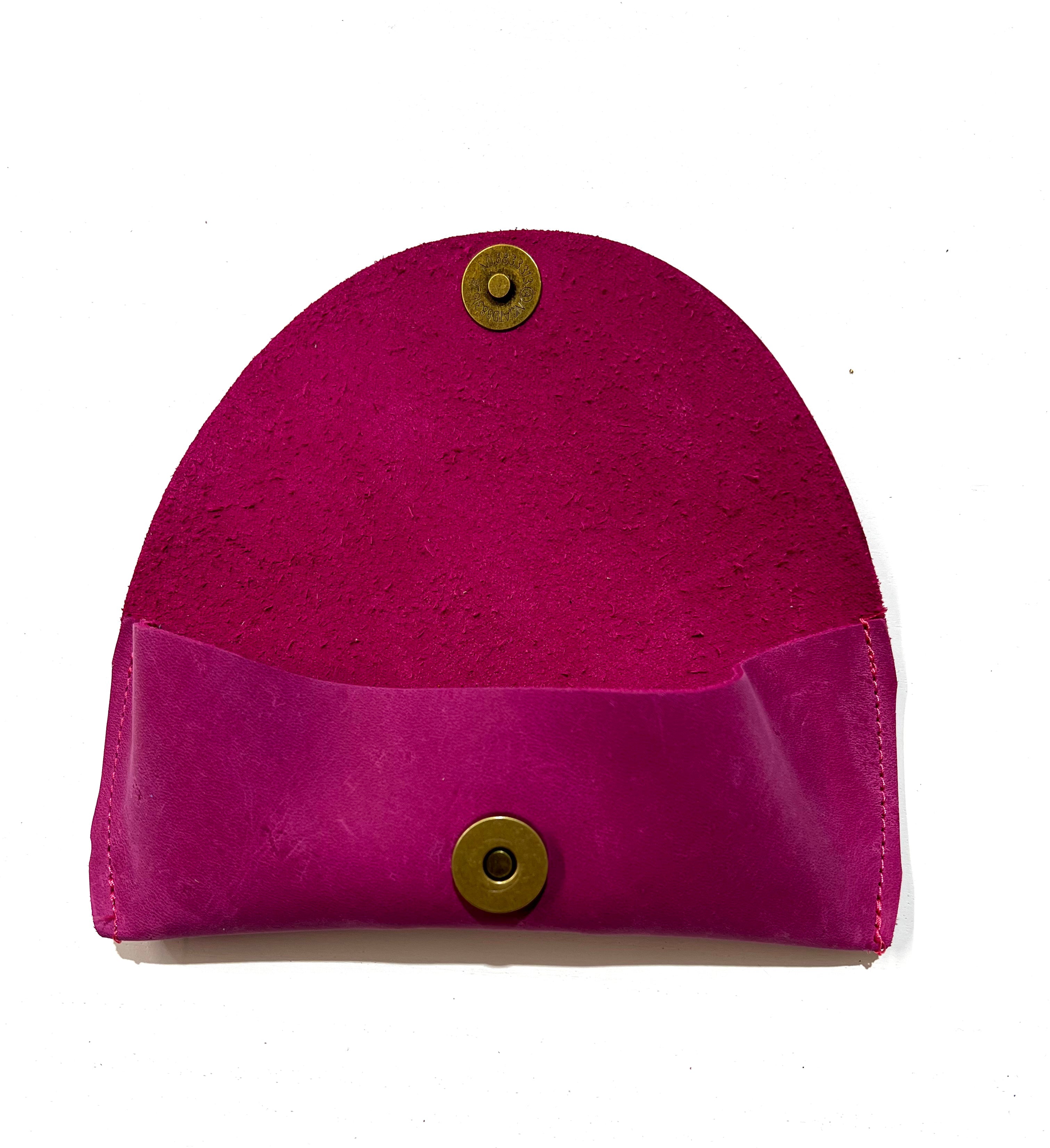 Open raspberry pink leather sunglasses case, displayed on a white background
