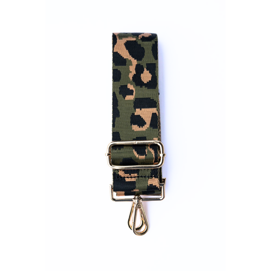 Army green, tan, and black adjustable crossbody strap with a leopard pattern and metal hardware, displayed on a white background