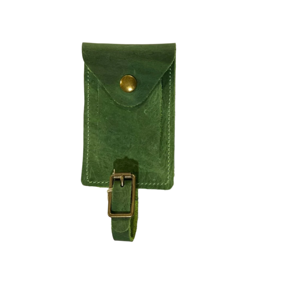 Back of evergreen luggage tag with a leather buckled strap and gold snap closure, displayed on a white background