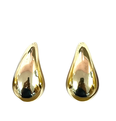 Pair of gold puffy teardrop earrings on a white background