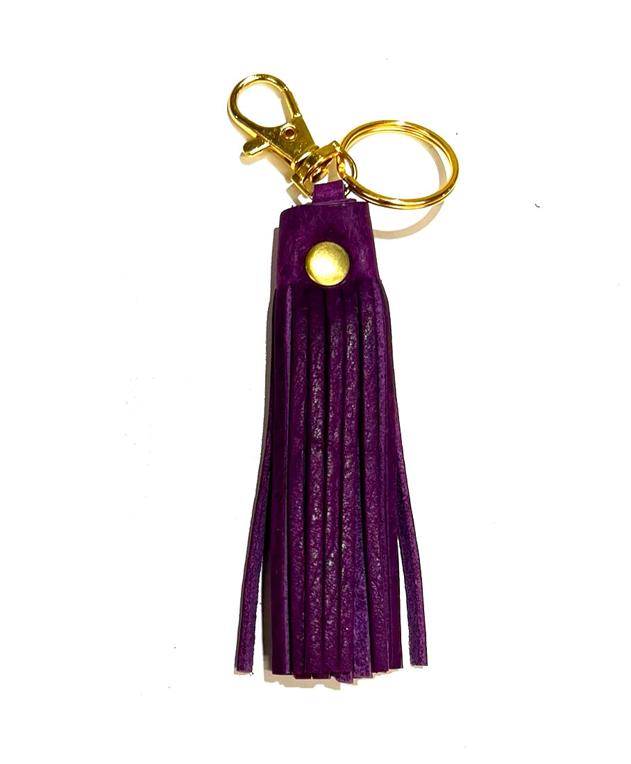 Purple leather tassel keychain, displayed on a white background