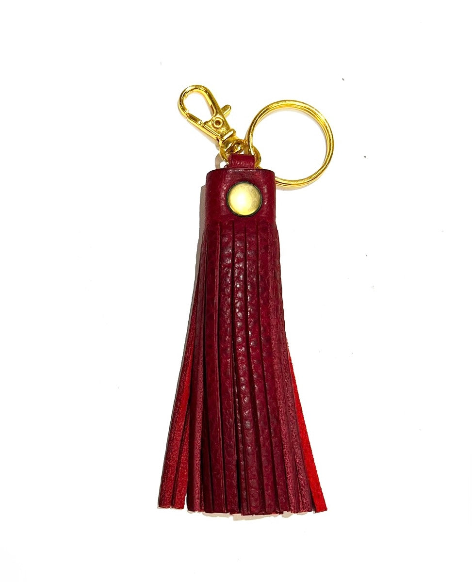 Red leather tassel keychain, displayed on a white background