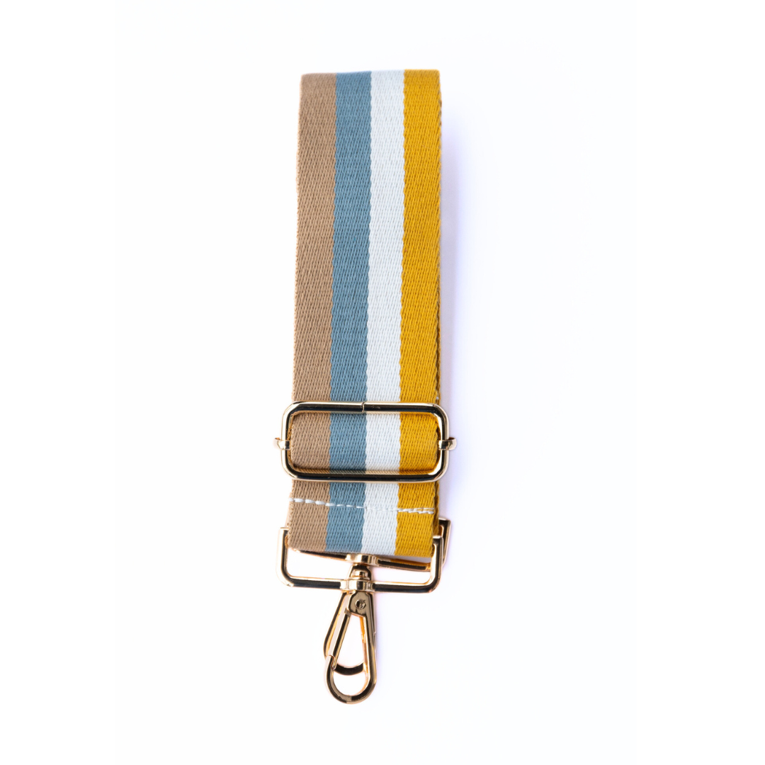 Brown, blue, white, and gold striped adjustable crossbody strap with metal hardware, displayed on a white background