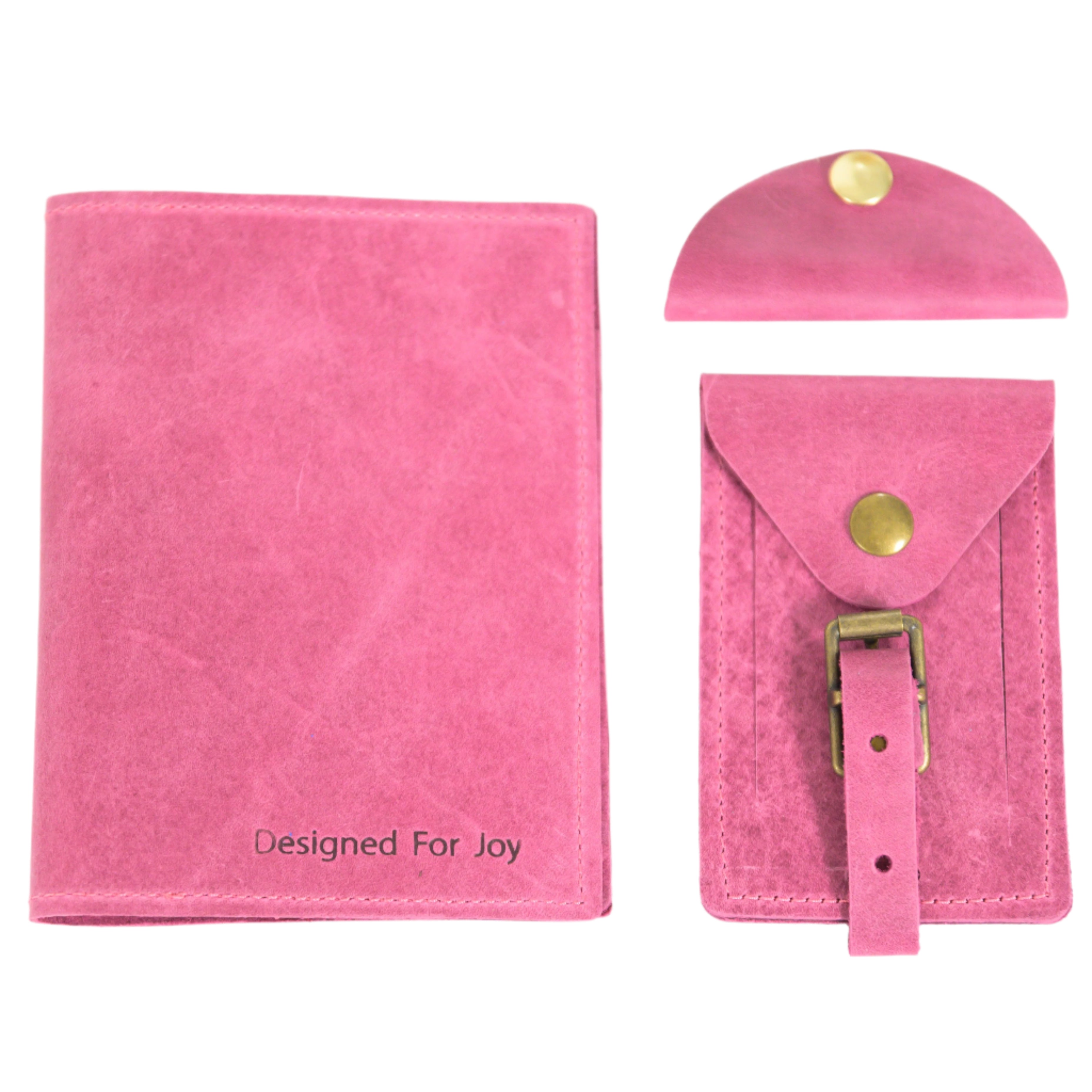Raspberry pink passport cover, cord organizer, and luggage tag, displayed on a white background