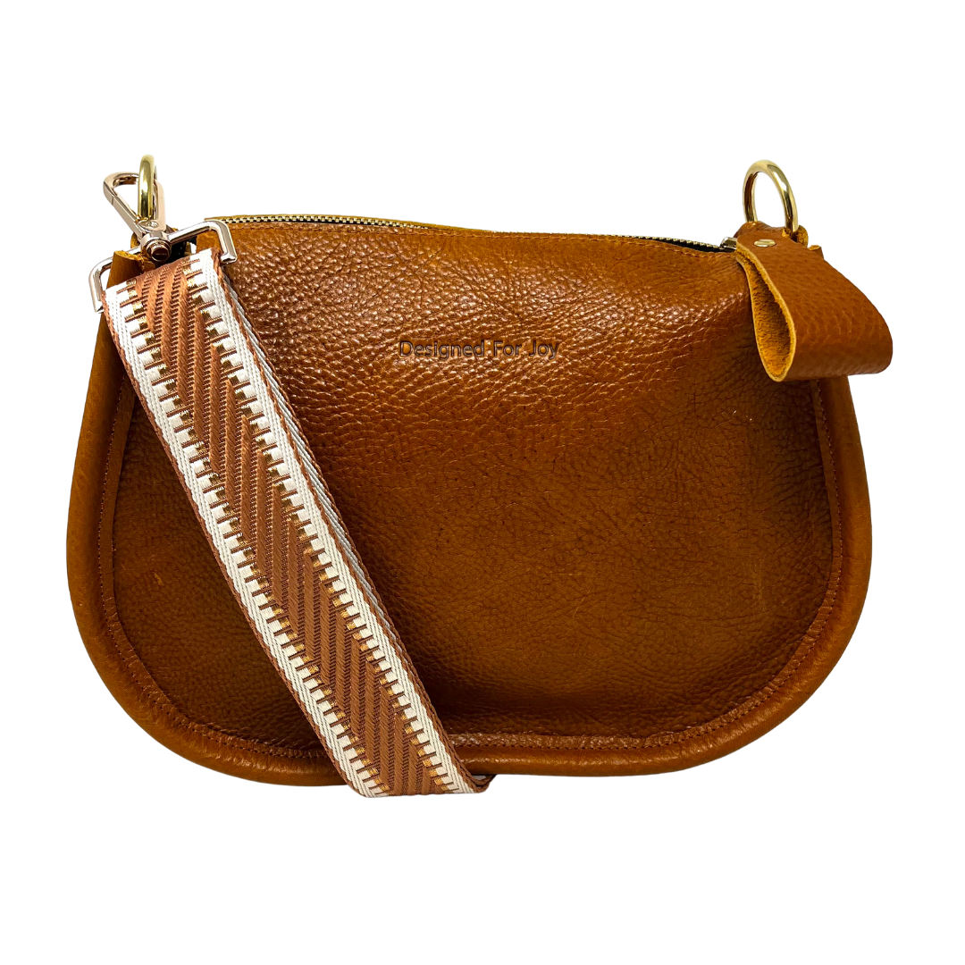 Caramel brown pebbled leather crossbody handbag with a smooth, chunky zipper and a crossbody strap