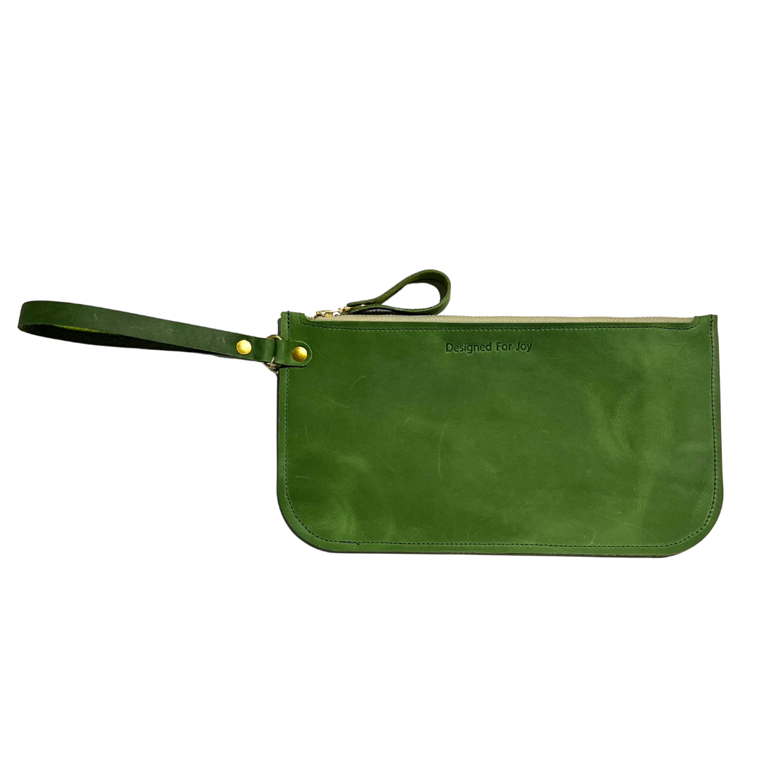 Evergreen leather slim zipper wristlet with 'Designed for Joy' text, displayed on a white background