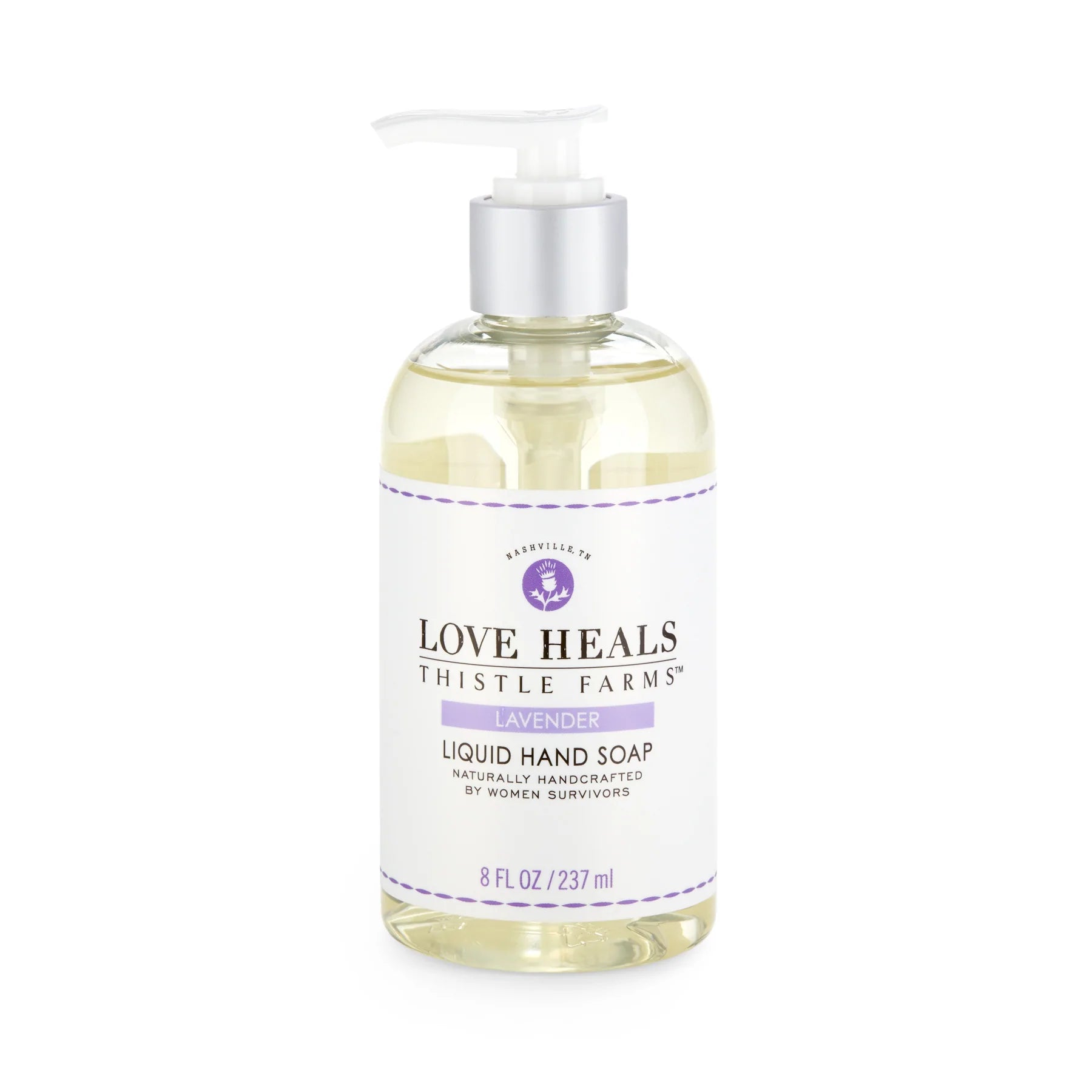Bottle of lavender liquid hand soap, branded 'Love Heals' by Thistle Farms, displayed on a white background