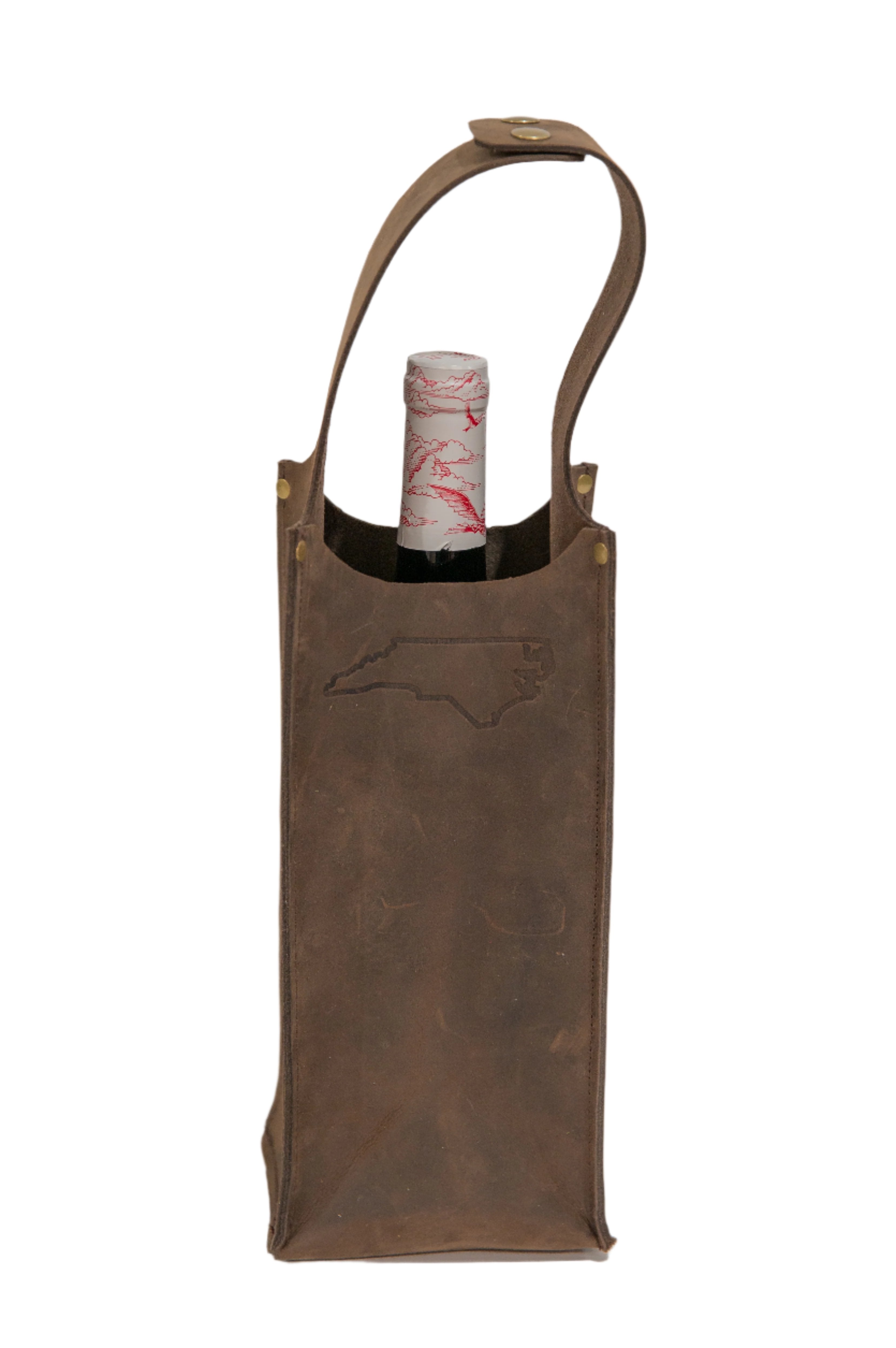 Wine bottle in a brown leather wine carrier with NC state outline stamped in the center, displayed on a white background