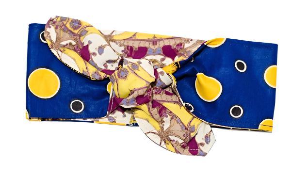 Reversible head wrap with a gold and blue pattern on one side and a floral pattern on the other, displayed on a white background