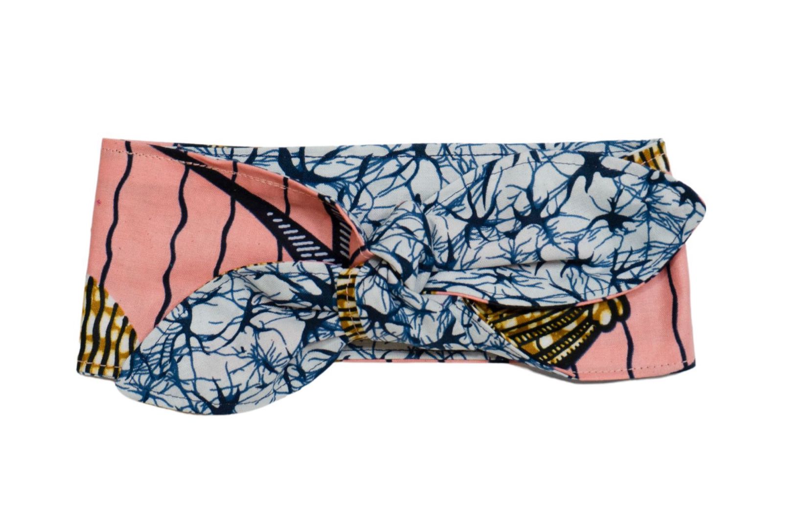 Reversible head wrap with a gold and pink pattern on one side and a blue pattern on the other, displayed on a white background