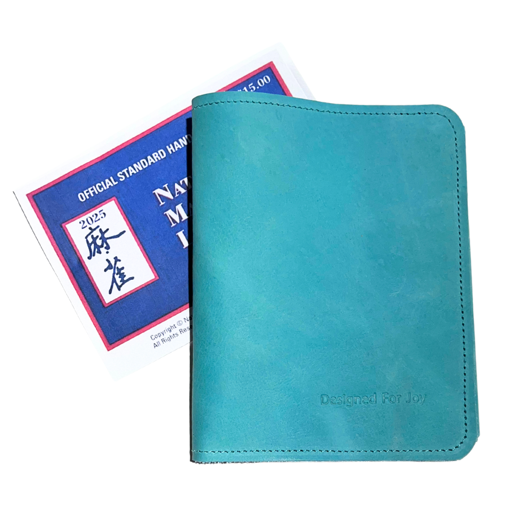 Aqua blue card holder with a Mahjong card behind it on a white background

