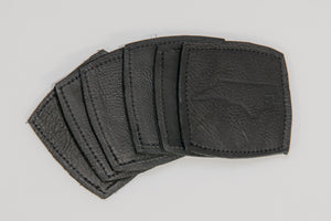 6 pack of black leather coasters with the North Carolina state outline branded into the leather.