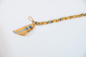 Gold and blue plaid scarf chain.