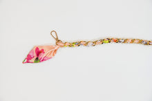 Pink floral scarf chain.