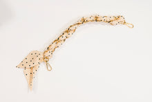 Scarf handbag  gold chain with black polka dots on cream scarf.